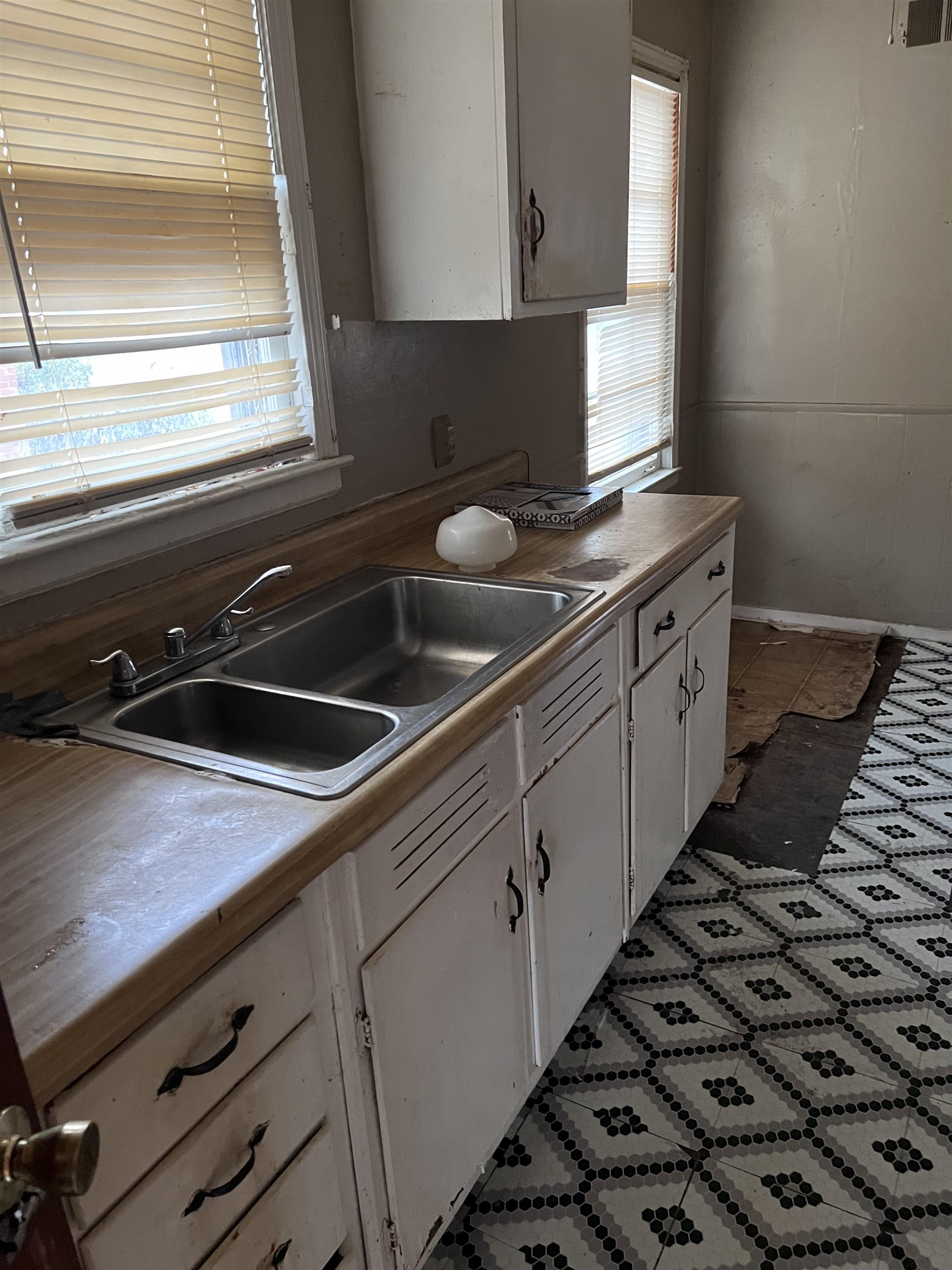 3040 South Edgeware Road Memphis, TN 38118 - Photo 9 of 12 Kitchen with white cabinetry, light countertops, and dark flooring