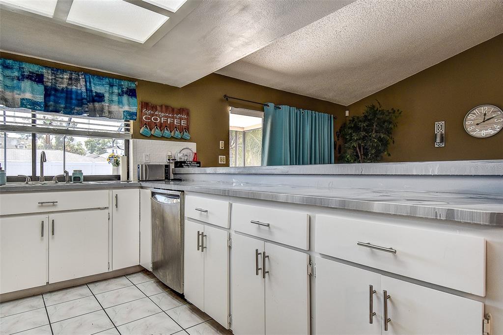 10440 Laval Street Spring Hill, FL 34608 - Photo 17 of 44 a kitchen with a sink cabinets and window