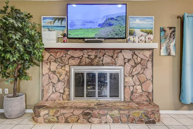 a living room with furniture and a mirror