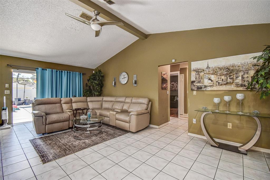10440 Laval Street Spring Hill, FL 34608 - Photo 25 of 44 a living room with furniture and a mirror