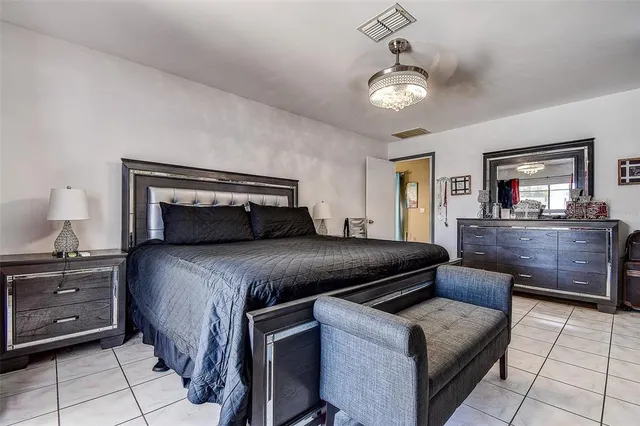 a bed room with a bed and a walk in closet