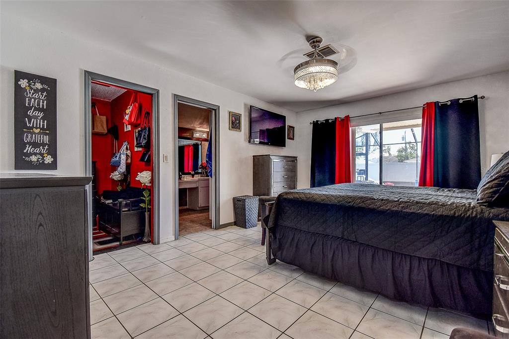 10440 Laval Street Spring Hill, FL 34608 - Photo 28 of 44 a bed room with a bed and a walk in closet