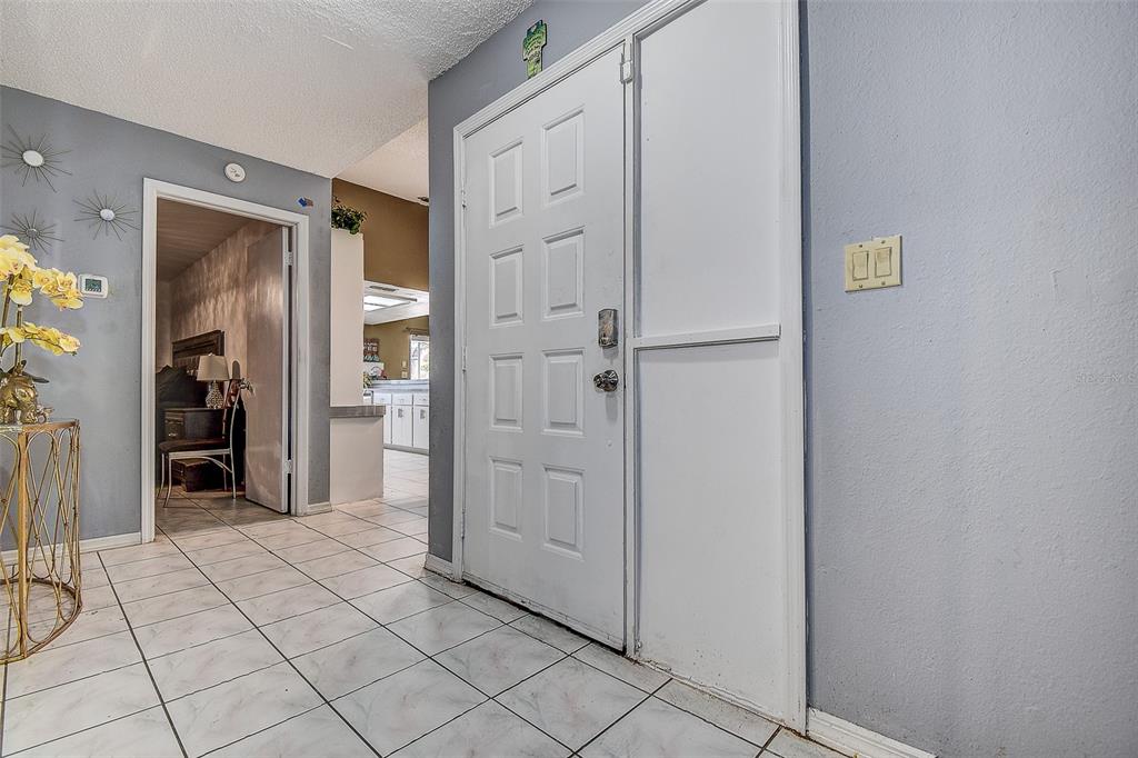 10440 Laval Street Spring Hill, FL 34608 - Photo 38 of 44 a view of a hallway with closet and bathroom