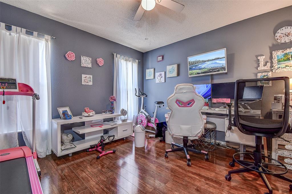 10440 Laval Street Spring Hill, FL 34608 - Photo 39 of 44 a living room with furniture and a wooden floor
