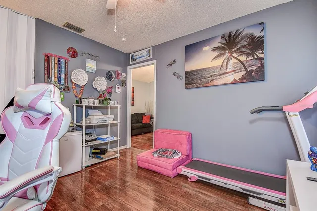 a living room with furniture a rug and a chandelier