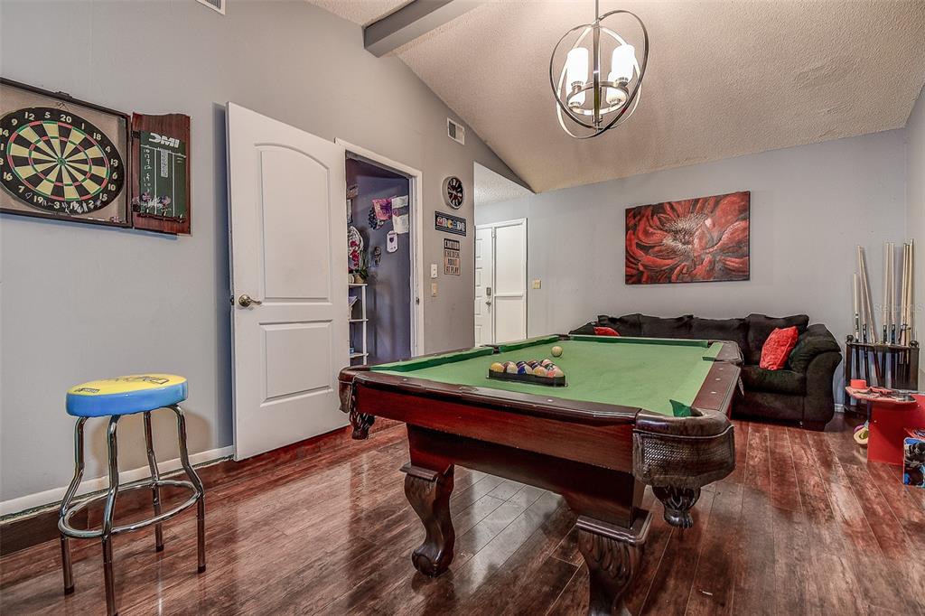 10440 Laval Street Spring Hill, FL 34608 - Photo 42 of 44 a room with furniture and wooden floor