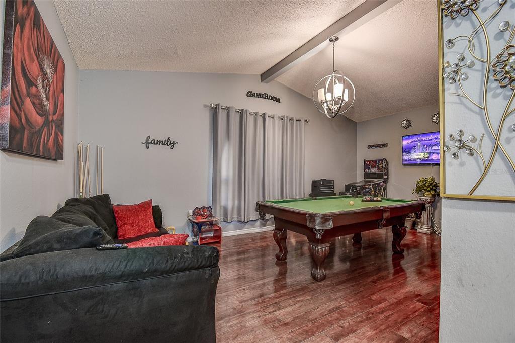 10440 Laval Street Spring Hill, FL 34608 - Photo 43 of 44 a living room with furniture and a wooden floor