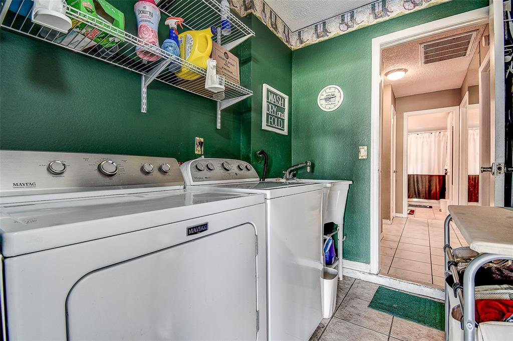 10440 Laval Street Spring Hill, FL 34608 - Photo 44 of 44 a utility room with dryer and washer
