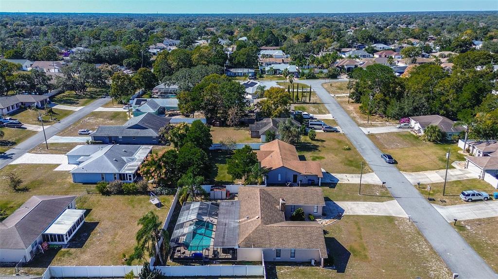 10440 Laval Street Spring Hill, FL 34608 - Photo 5 of 44 an aerial view of residential houses with outdoor space