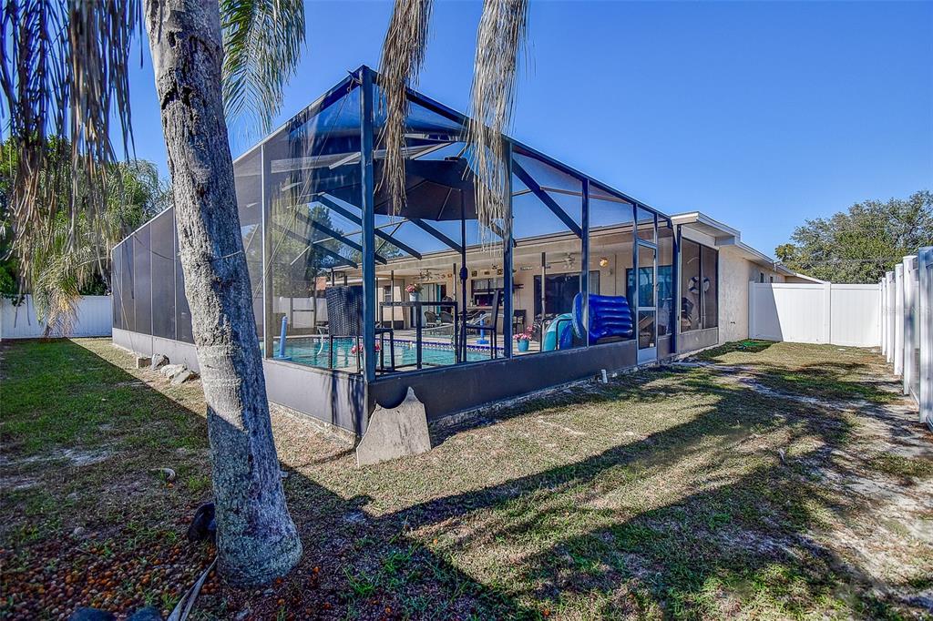 10440 Laval Street Spring Hill, FL 34608 - Photo 6 of 44 a view of a house with a yard