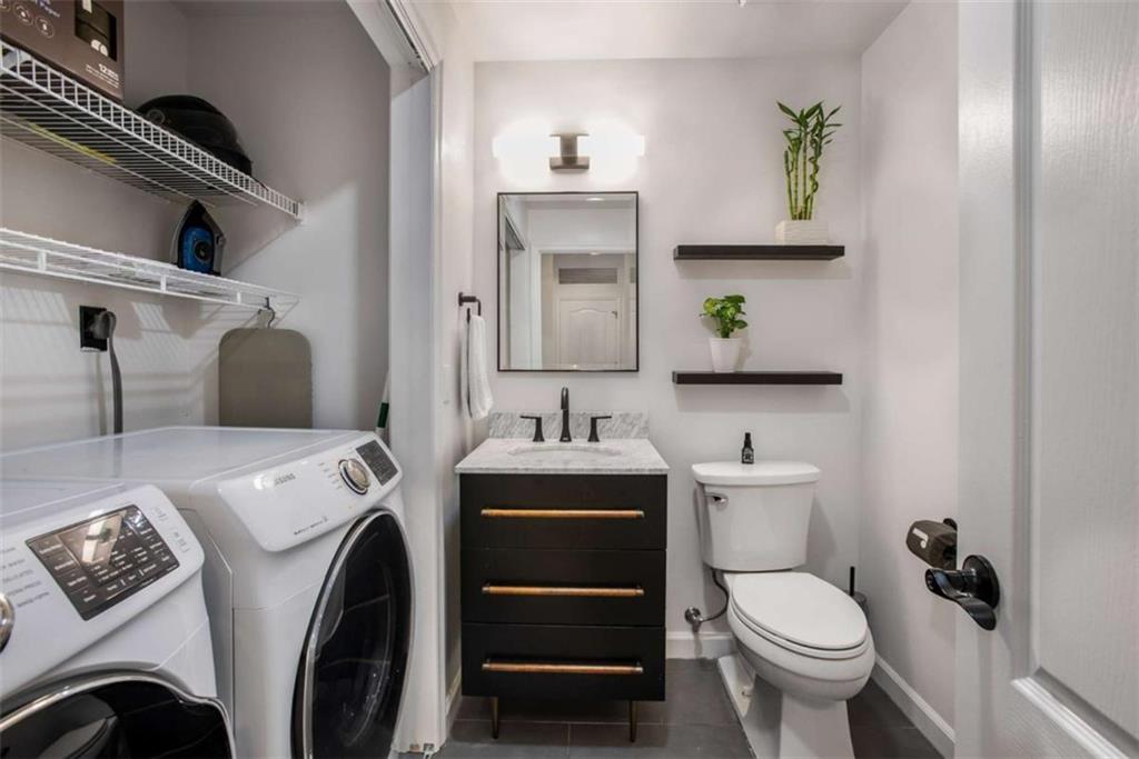 3475 Oak Valley Road Northeast, Unit 1630 Atlanta, GA 30326 - Photo 22 of 38 a bathroom with a sink and a toilet