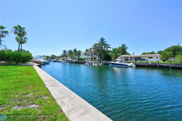 a view of a lake with a building in the background