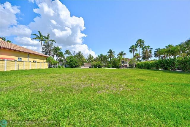 a view of a lake with boats and trees in the background