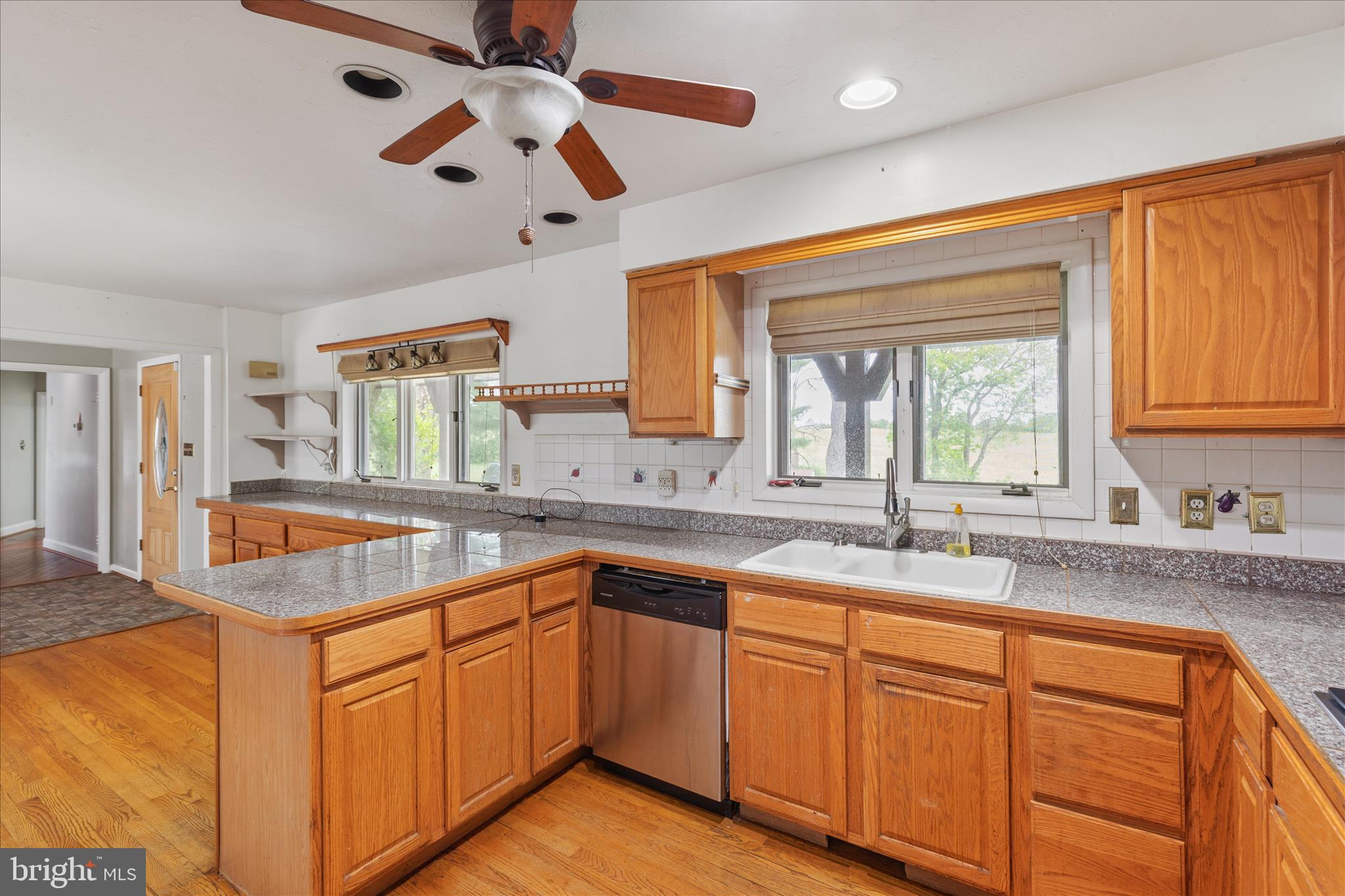 263 Bowling Green Road Front Royal, VA 22630 - Photo 25 of 75 a kitchen with granite countertop cabinets stainless steel appliances a sink and a window
