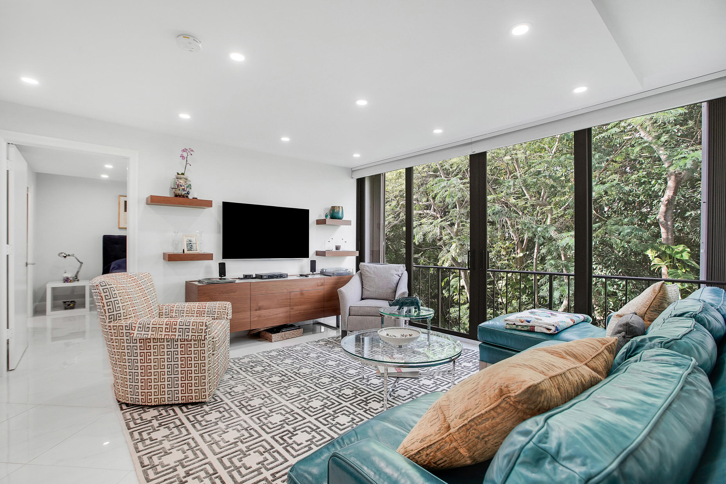 501 Southwest 11th Place, Unit 317 Boca Raton, FL 33432 - Photo 12 of 28 a living room with furniture and a flat screen tv
