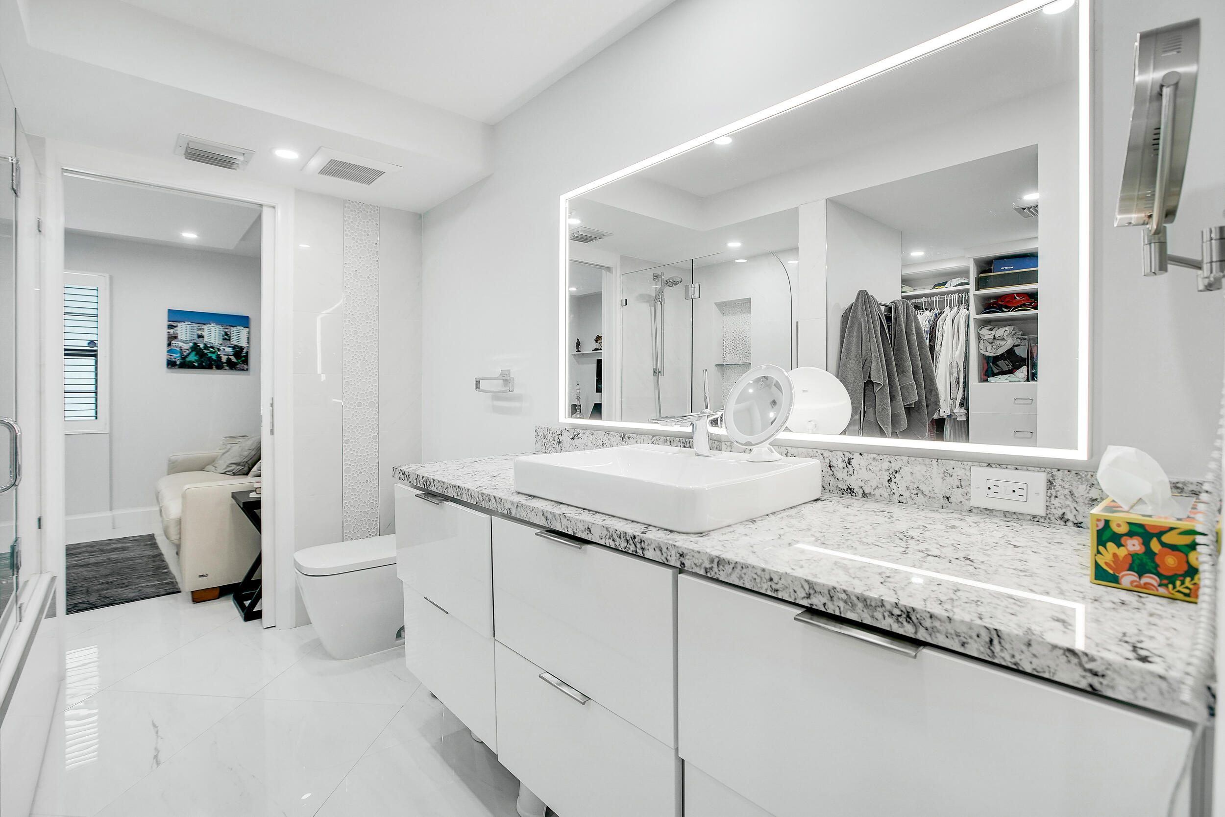 501 Southwest 11th Place, Unit 317 Boca Raton, FL 33432 - Photo 14 of 28 a bathroom with a granite countertop sink and a mirror