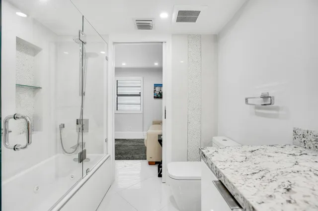 a bathroom with a sink and shower