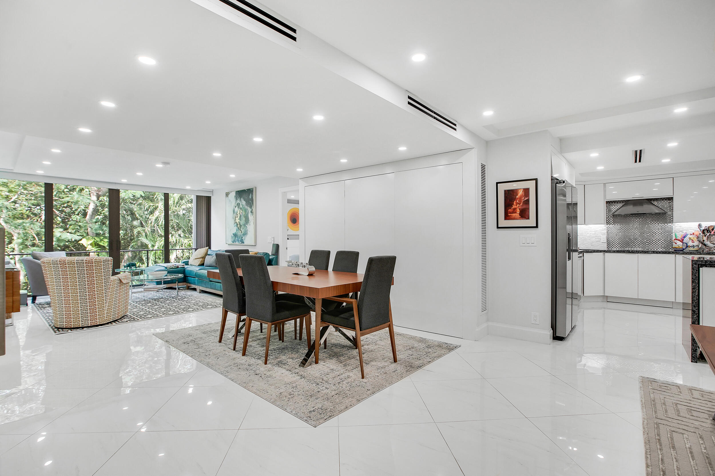 501 Southwest 11th Place, Unit 317 Boca Raton, FL 33432 - Photo 2 of 28 a view of a dining room with furniture window and outside view