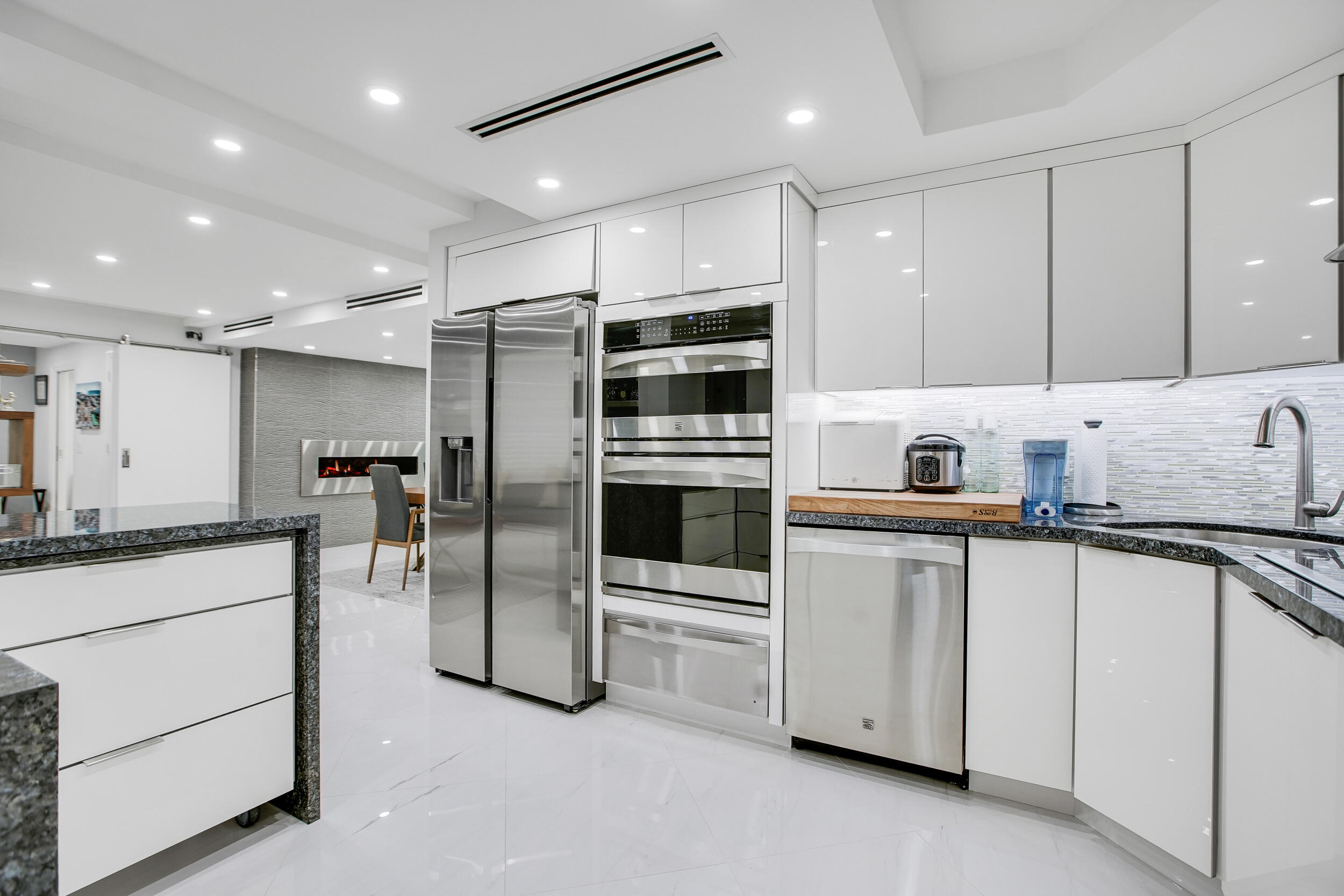 501 Southwest 11th Place, Unit 317 Boca Raton, FL 33432 - Photo 21 of 28 a kitchen with stainless steel appliances a refrigerator sink and microwave