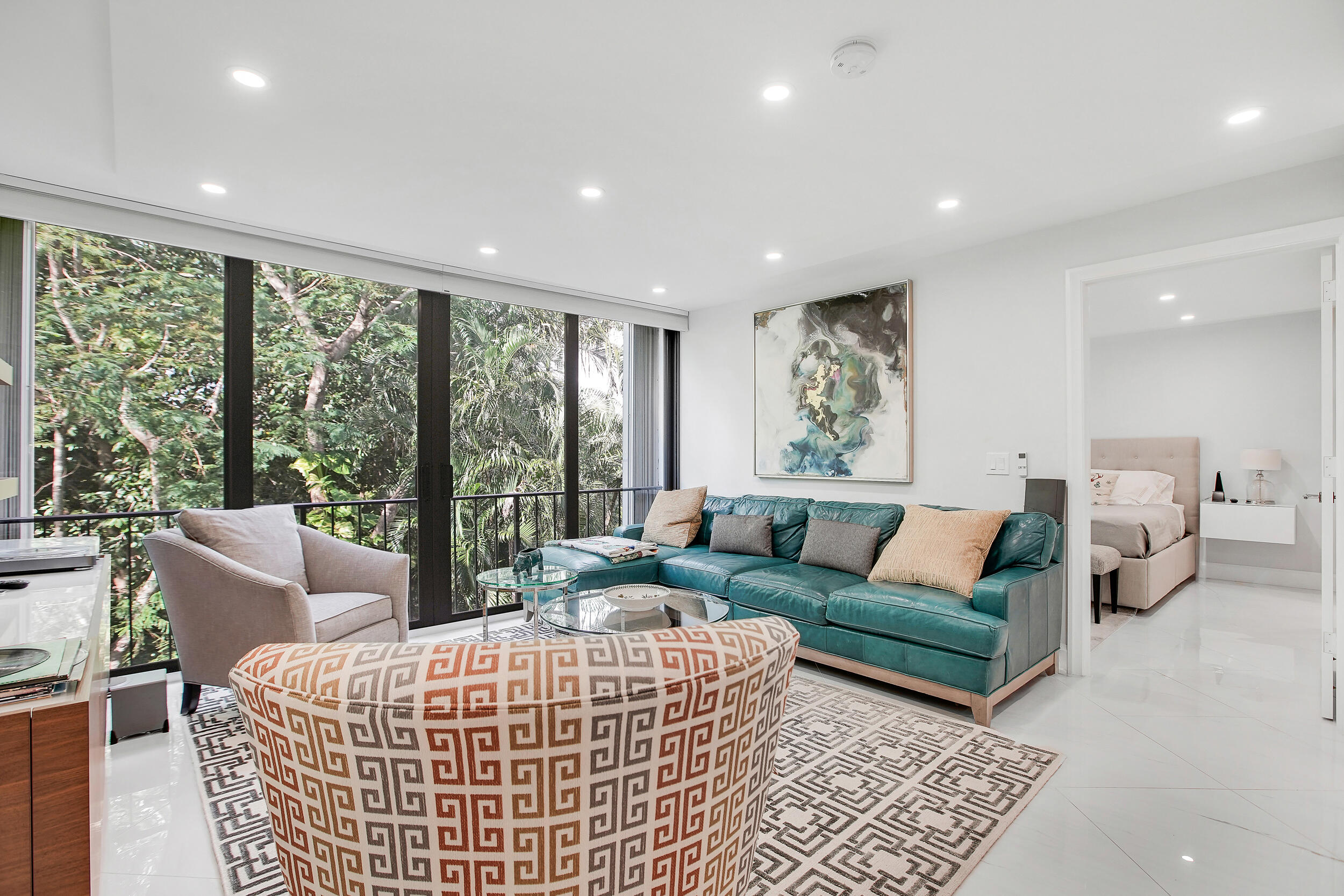 501 Southwest 11th Place, Unit 317 Boca Raton, FL 33432 - Photo 5 of 28 a living room with furniture and large windows