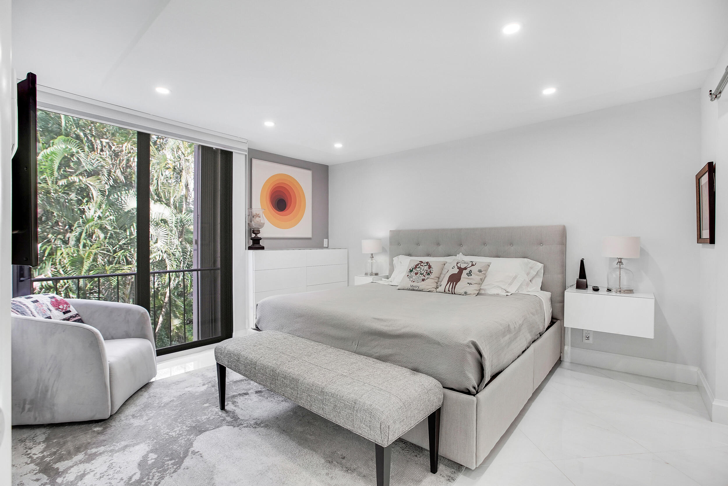 501 Southwest 11th Place, Unit 317 Boca Raton, FL 33432 - Photo 6 of 28 a bedroom with a bed and glass window