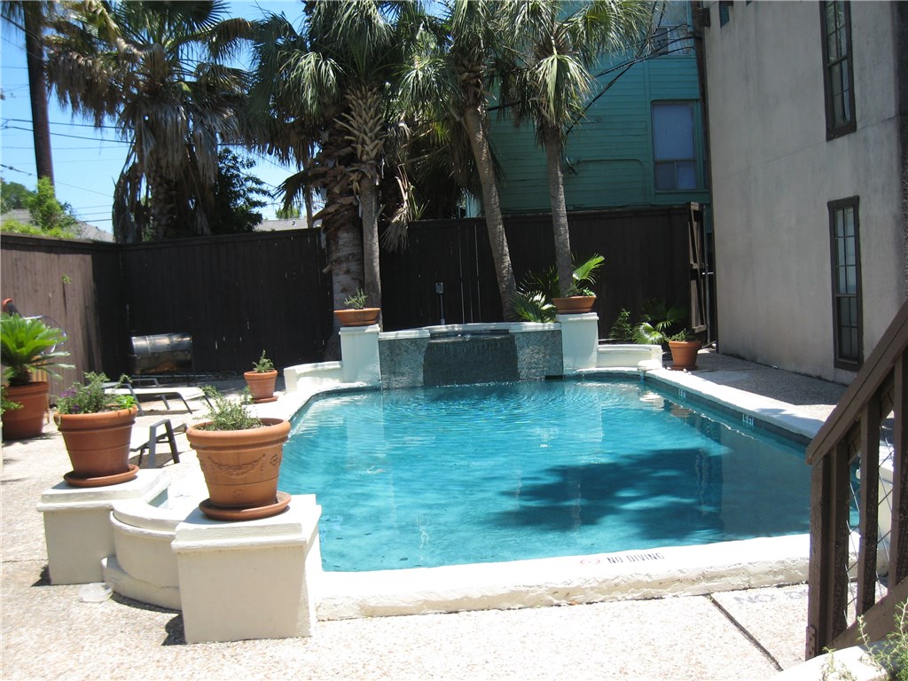 110 East 37th Street, Unit 108 Austin, TX 78705 - Photo 1 of 1 a view of a house with backyard sitting area and fire pit