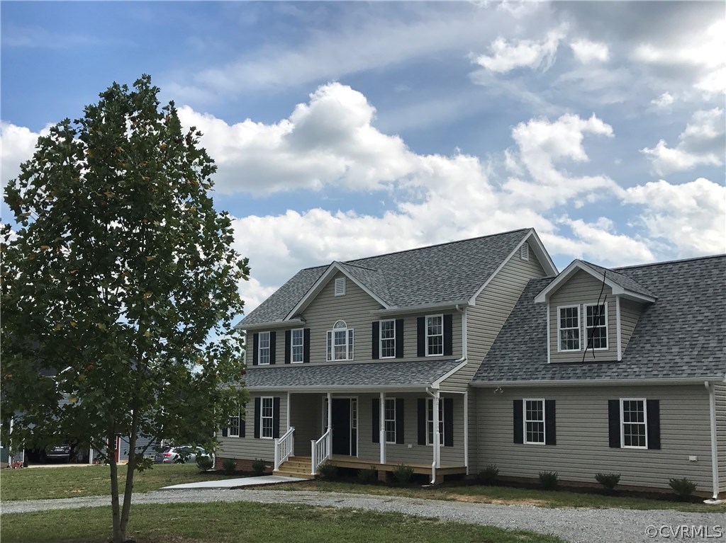 3867 Sage Road Sandy Hook, VA 23153 - Photo 1 of 6 a front view of a house with a garden