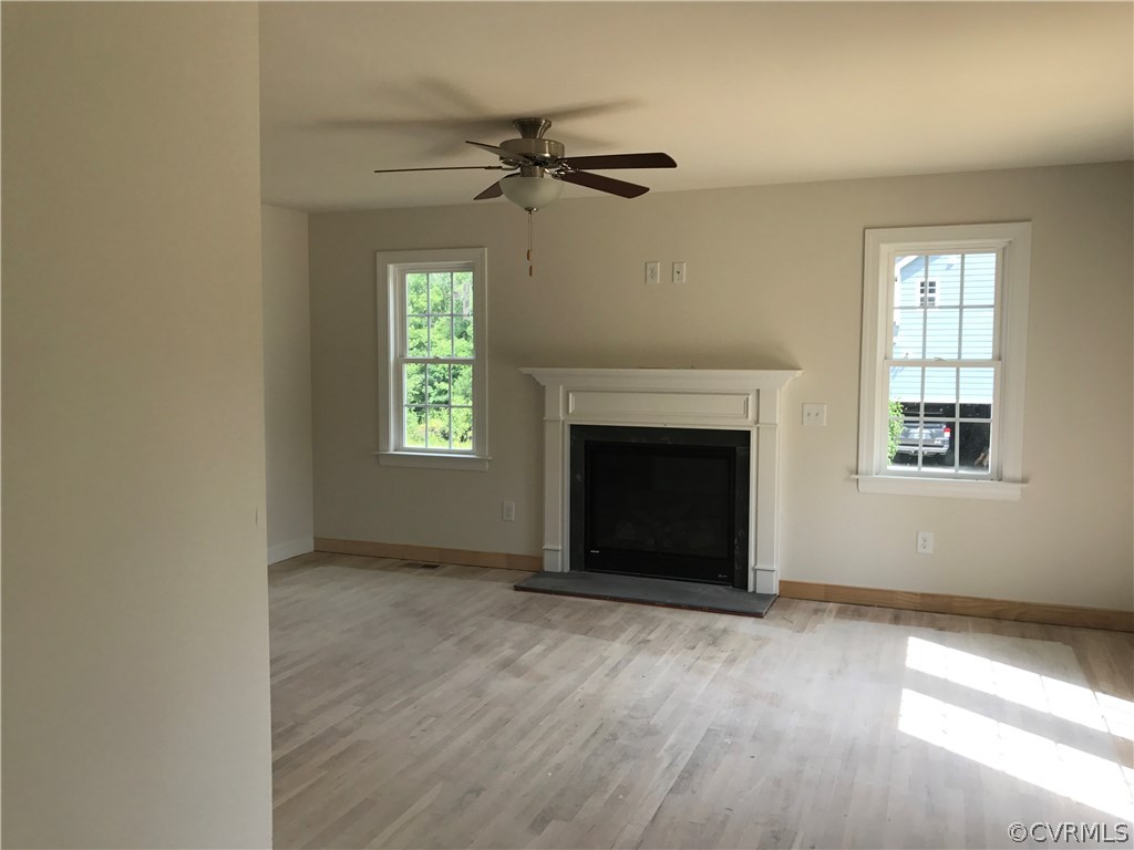 3867 Sage Road Sandy Hook, VA 23153 - Photo 5 of 6 a view of an empty room with a window and fireplace