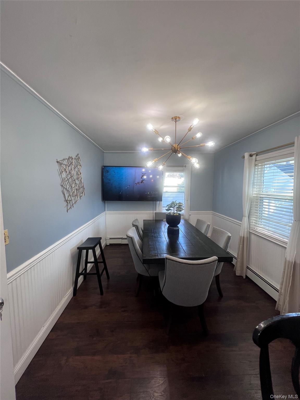 44 Frank Street Valley Stream, NY 11580 - Photo 11 of 23 a view of a dining room with furniture window and wooden floor