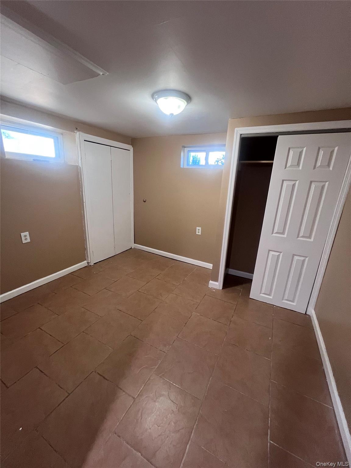 44 Frank Street Valley Stream, NY 11580 - Photo 14 of 23 an empty room with windows