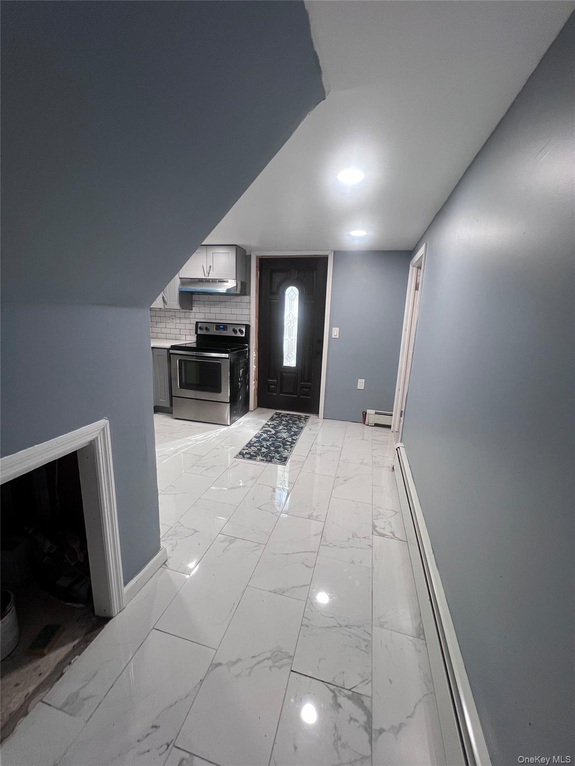 44 Frank Street Valley Stream, NY 11580 - Photo 15 of 23 a view of a livingroom with a fireplace