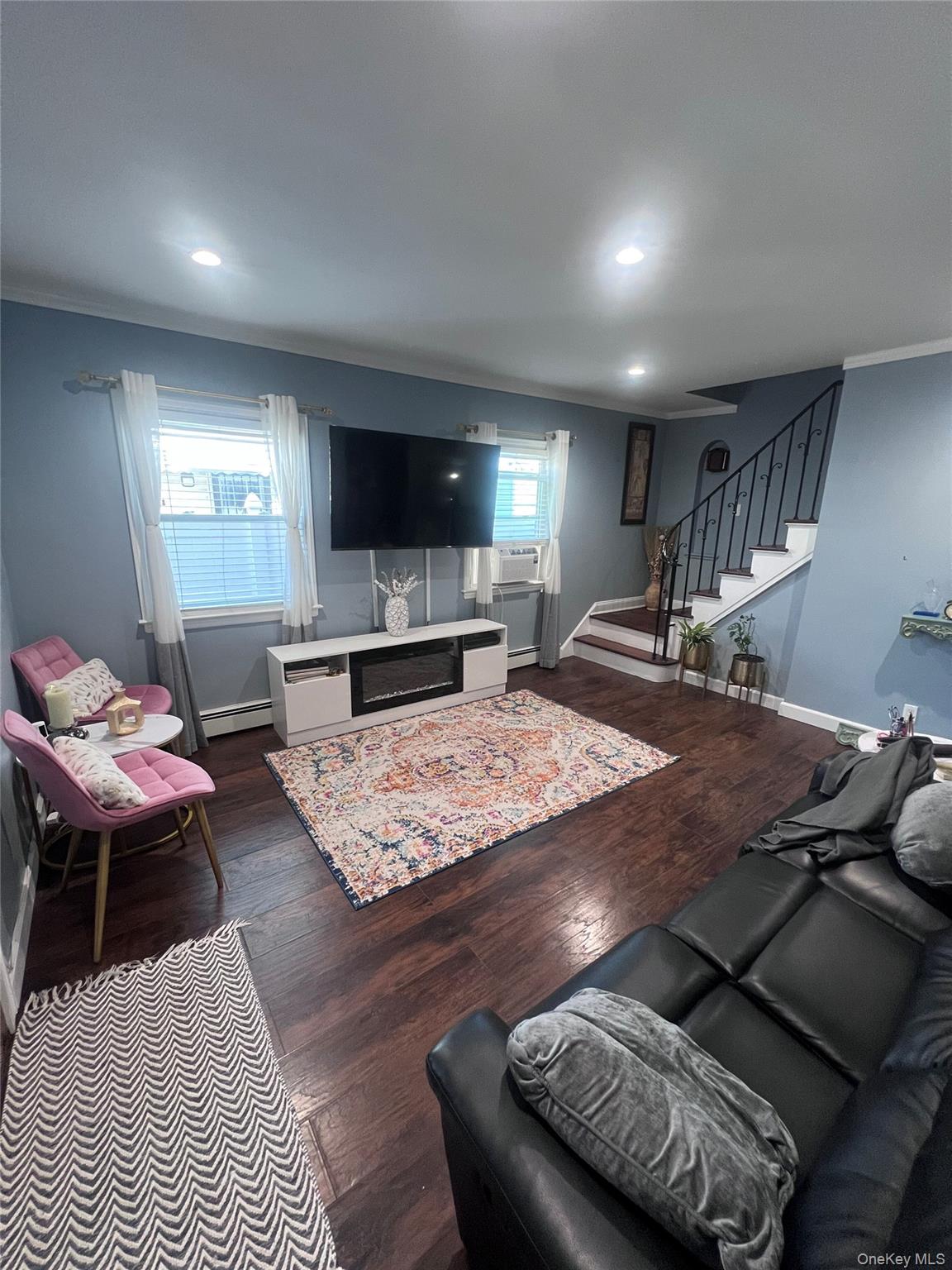 44 Frank Street Valley Stream, NY 11580 - Photo 3 of 23 a living room with furniture and a flat screen tv