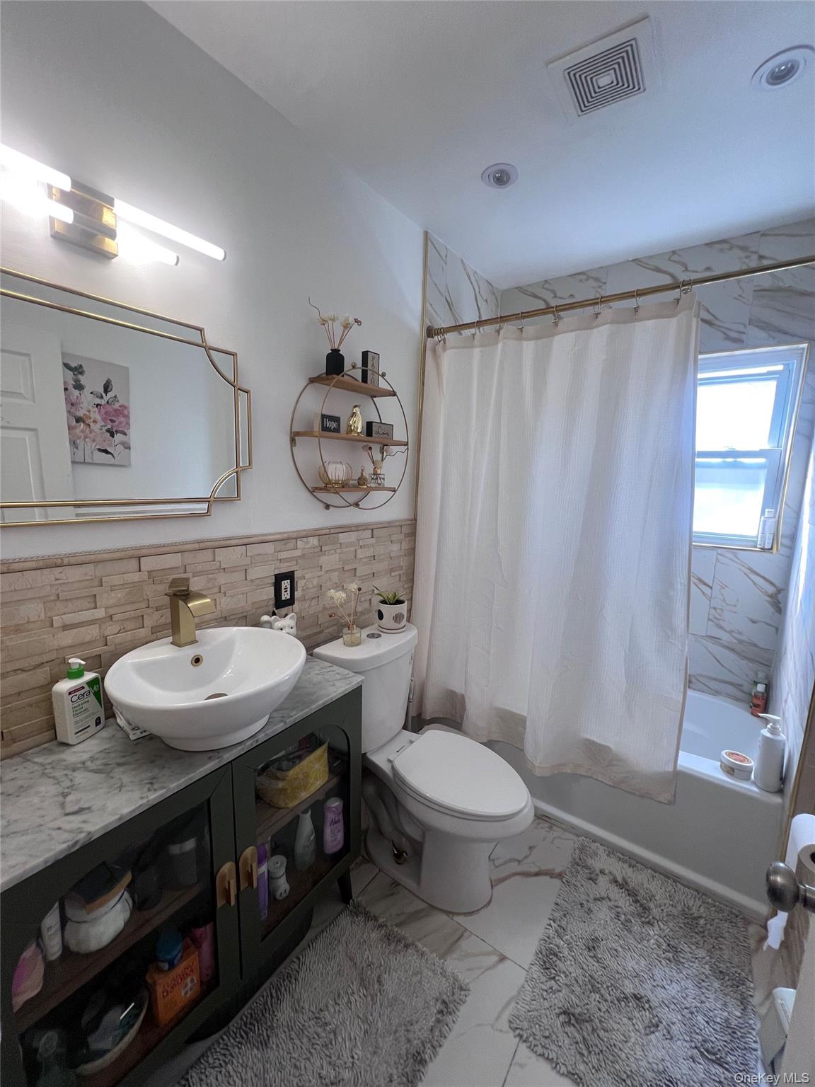 44 Frank Street Valley Stream, NY 11580 - Photo 6 of 23 a bathroom with a sink toilet and shower