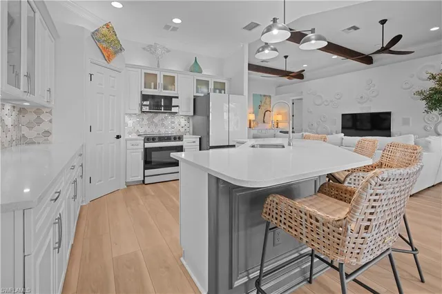 $990,000 | 6977 Bent Grass Drive, Naples, FL 34113