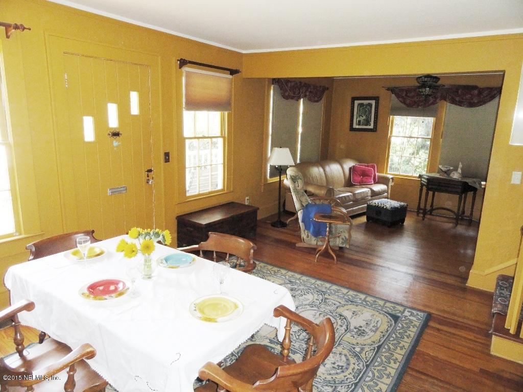 1615 Lorimier Road Jacksonville, FL 32207 - Photo 11 of 53 a living room with dining table and a couch