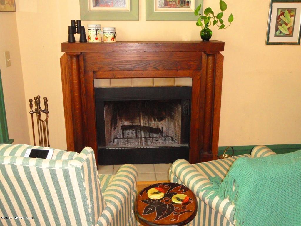 1615 Lorimier Road Jacksonville, FL 32207 - Photo 18 of 53 a bedroom with a bed and a fireplace