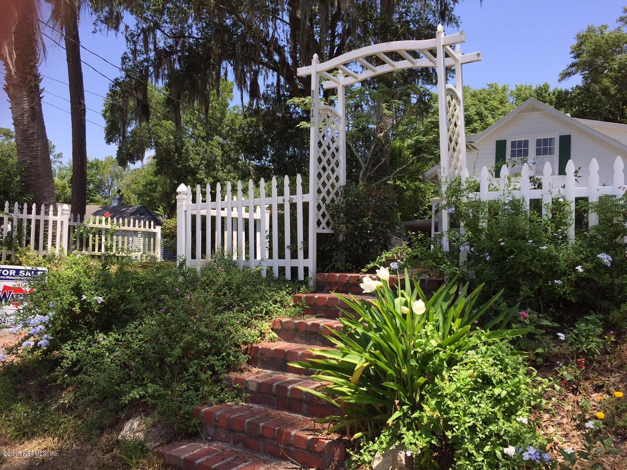 1615 Lorimier Road Jacksonville, FL 32207 - Photo 2 of 53 a front view of a house with a garden