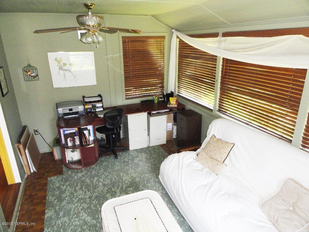 1615 Lorimier Road Jacksonville, FL 32207 - Photo 21 of 53 a bedroom with furniture and a window