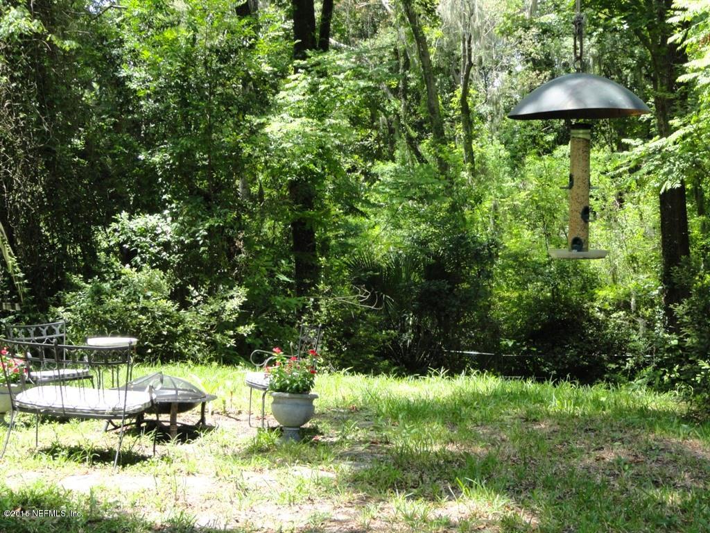 1615 Lorimier Road Jacksonville, FL 32207 - Photo 38 of 53 a backyard of a house with table and chairs