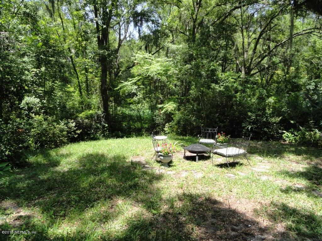 1615 Lorimier Road Jacksonville, FL 32207 - Photo 40 of 53 a view of backyard with a table and chairs