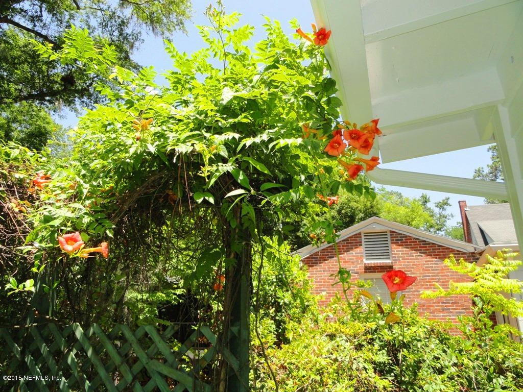 1615 Lorimier Road Jacksonville, FL 32207 - Photo 42 of 53 a backyard of a house with a lot of flowers