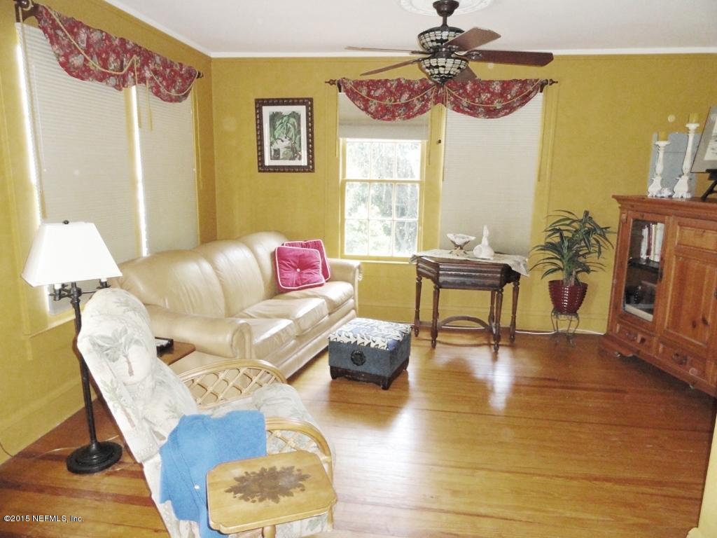 1615 Lorimier Road Jacksonville, FL 32207 - Photo 8 of 53 a living room with furniture and a chandelier