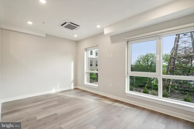 a view of an empty room with a window