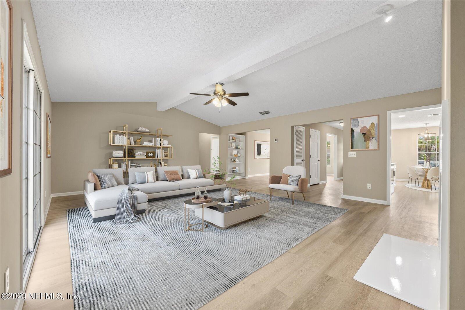 1566 Rusty Rail Road Jacksonville, FL 32225 - Photo 9 of 45 a living room with furniture and a large window