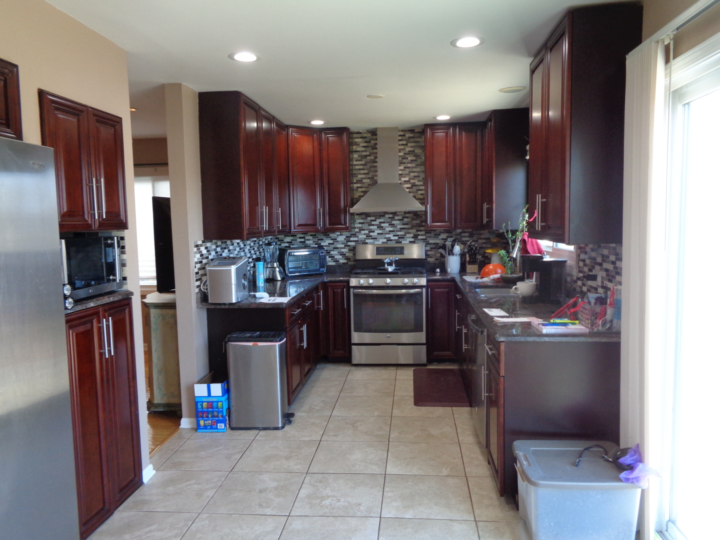 459 Barberry Road Highland Park, IL 60035 - Photo 2 of 11 a kitchen with a stove top oven and cabinets