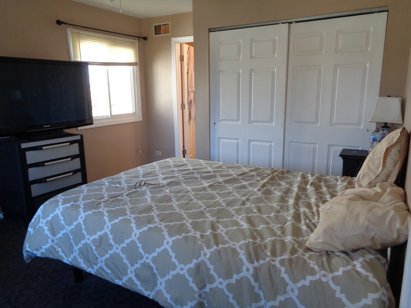 459 Barberry Road Highland Park, IL 60035 - Photo 5 of 11 a bedroom with a bed and a flat screen tv