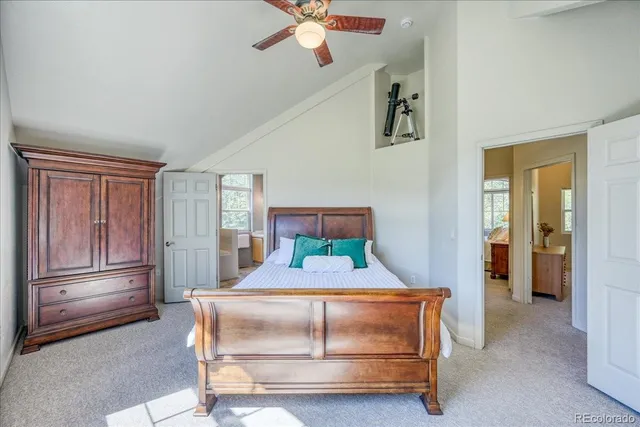 a bedroom with a bed and cabinet