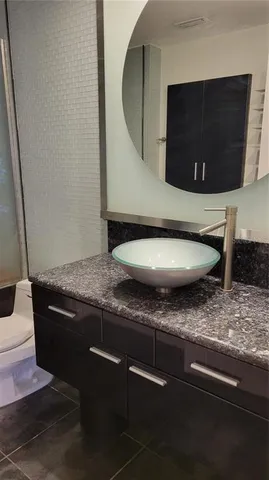 a living room with stainless steel appliances