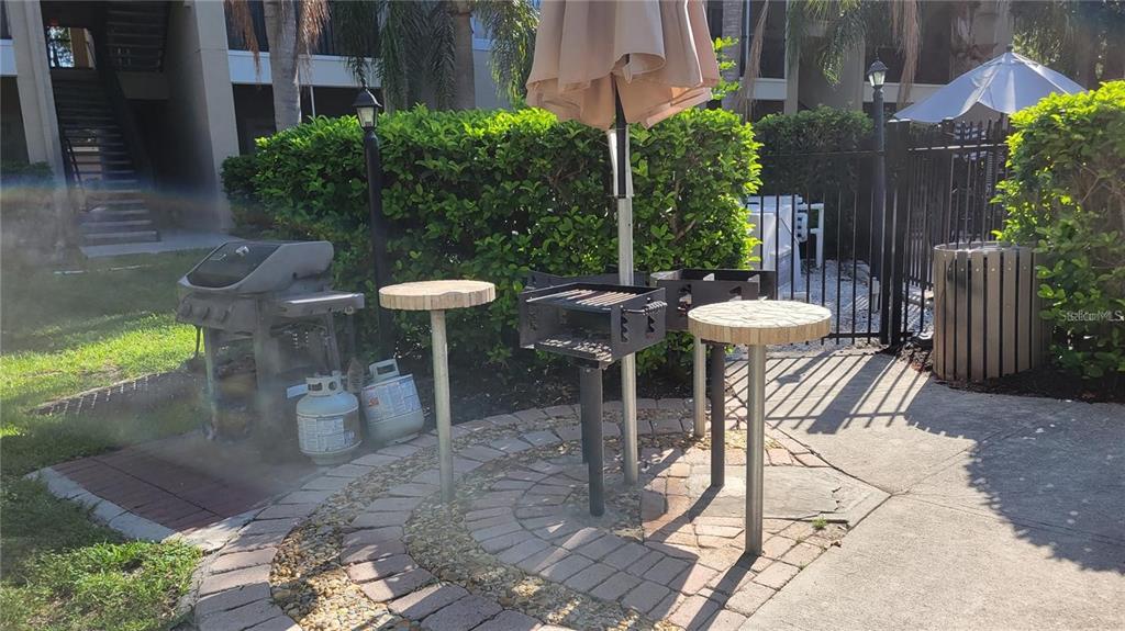 5168 Northridge Road, Unit 106 Sarasota, FL 34238 - Photo 18 of 33 a view of a tables and chairs in patio