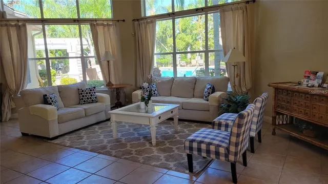 a living room with furniture and a window